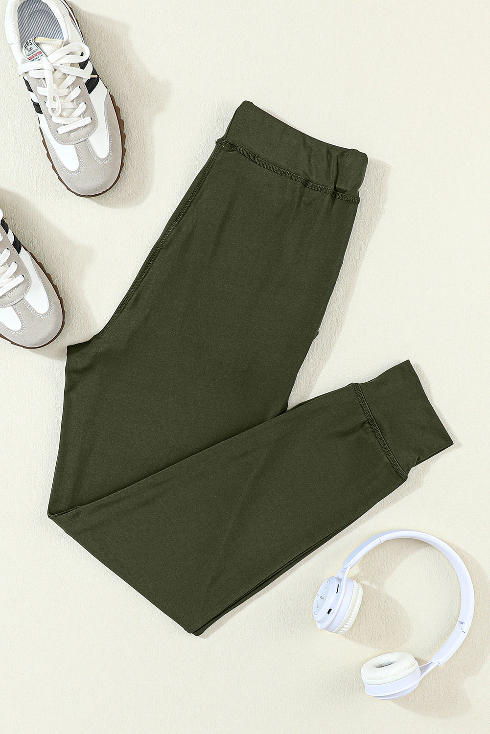 Moss green joggers with drawstring.